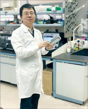  ?? PROVIDED TO CHINA DAILY ?? Feng Liang, a researcher at the Dalian Institute of Chemical Physics, is working on sensor technology that will enable people to use a mobile phone app to test whether vegetables or fruits are contaminat­ed with pesticides.