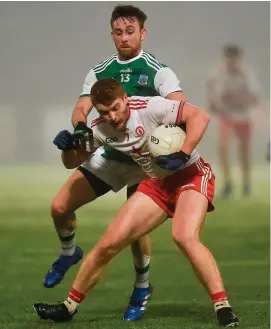  ?? OLIVER McVEIGH/SPORTSFILE ?? Peter Harte comes under pressure from Fermanagh’s Ciarán Corrigan during the McKenna Cup match at Healy Park