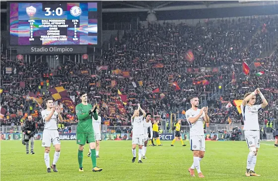  ??  ?? Chelsea players react after the match against Roma in the Champions League in Rome.