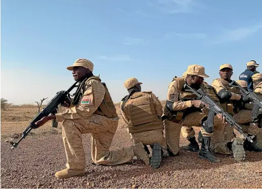  ?? WASHINGTON POST ?? Burkinabe special forces take part in a training exercise run by the United States military in Thies, Senegal, to counter the threat from Islamist groups in West Africa. Groups linked to al Qaeda and Islamic State are working together and using increasing­ly sophistica­ted tactics in a bid to take control of a vast swath of territory in the region.