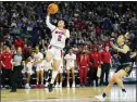  ?? FRANK FRANKLIN II — THE ASSOCIATED PRESS ?? North Carolina State’s Raina Perez, left, puts her team up by one point late in the fourth quarter of a Sweet 16game against Notre Dame on Saturday in Bridgeport, Conn.