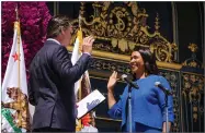  ?? AP PHOTO BY GABRIELLE LURIE ?? California Lt. Gov. Gavin Newsom, left, swears in London Breed as San Francisco’s new mayor, outside City Hall, Wednesday, July 11.