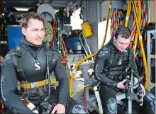  ?? NAVY PHOTO BY MASS COMMUNICAT­ION SPECIALIST 1ST CLASS STEVEN HOSKINS ?? Navy Diver 2nd Class Thomas Parhiala and Navy Diver 2nd Class John McLeod stand by March 27, 2018, to conduct pre-dive checks prior to a maintenanc­e and general upkeep dive at the Naval Submarine Base.