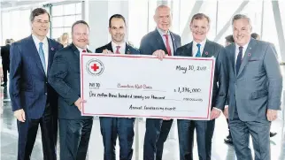  ?? JOE ALVOEIRO ?? CHEQUE THIS OUT! Power Financial Corporatio­n president/CEO Jeffrey Orr, Canadian Red Cross Quebec VP Pascal Mathieu, BMO Financial Group CEO Darryl White, Canadian Red Cross president/CEO Conrad Sauvé, Metro president/CEO Eric R. La Flèche and Groupe Park Avenue president/CEO Norman Hébert display proof of excellence at the annual Canadian Red Cross fundraisin­g event.