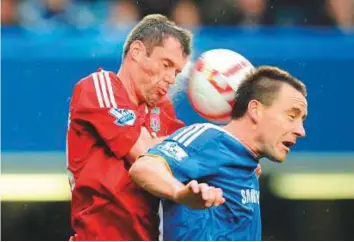  ?? Rex Features ?? Former Liverpool defender Jamie Carragher (left) rates departing Chelsea star John Terry (right) as the best centre-back in the Premier League era.