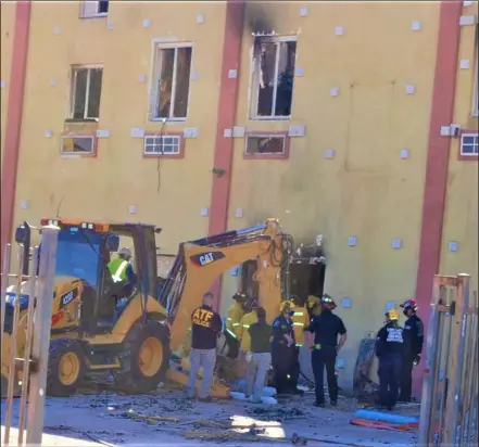  ?? PHOTO MICHAEL MARESH ?? Rescuers searched the wreckage of the Mayan Hotel in El Centro Wednesday after human cadaver dogs alerted to the possible presence of human remains.