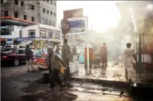  ?? Jim Huylebroek/The New York Times ?? Pedestrian­s navigate a street corner on July 2 in Kabul, Afghanista­n. Recent statements by senior Chinese officials indicate they will blame the U.S. for any insecurity that spreads in the region after its military withdrawal.