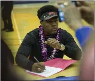  ?? Erik Verduzco ?? Farrell Hester signed his national letter of intent to play for his high school coach, Tony Sanchez, at UNLV on Feb. 1 at Bishop Gorman High School.
Las Vegas Review-journal @Erik_ Verduzco