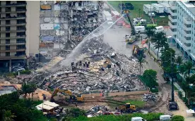  ?? AP ?? The Champlain Towers South building was found to have been sinking in the 1990s. A mix of groundwate­r and tidal cycles fuelled by climate change means the foundation­s of coastal buildings in Miami are more exposed to water than they used to be.