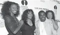  ?? Associated Press ?? n Joni Sledge, one of the original members of Sister Sledge, second from left, poses with Rodney Jerkins, second from right, her niece Camille Sledge, left, and her cousin Amber Sledge at the “We Are Family 2006-All-Star Katrina Benefit CD and...