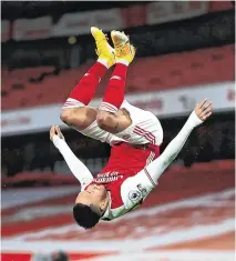  ?? GETTY ?? Pierre-Emerick Aubameyang celebrates acrobatica­lly after scoring Arsenal’s opening goal against Newcastle