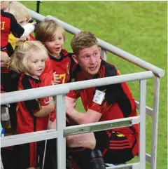  ?? (Reuters) ?? Belgium’s Kevin De Bruyne celebrates in the stands with his children after the match against Canada on Wednesday.