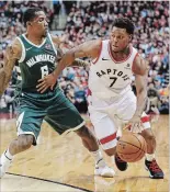  ?? RICK MADONIK
TORONTO STAR ?? Raptors guard Kyle Lowry tries to drive around Milwaukee Bucks guard Eric Bledsoe in Toronto on Sunday.Lowry didn’t have a point in the Raptors’ 104-99 loss.