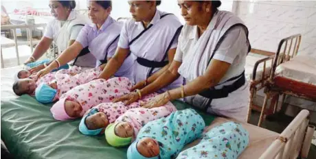  ?? — PTI ?? Nurses holding newly-born children at a maternity ward on World Population Day at a government hospital in the northeaste­rn state of Tripura, on Monday. India’s population touched 1.33 billion on Monday, showing an annual rise of 1.18 per cent....