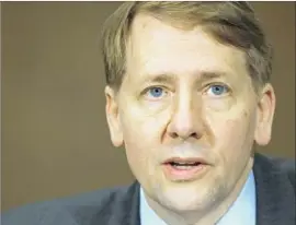  ?? Jacquelyn Martin Associated Press ?? RICHARD CORDRAY was appointed by President Obama as the f irst director of the Consumer Financial Protection Bureau; his term was not set to expire till July.