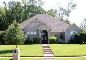  ?? CODY GRAVES/Arkansas Democrat-Gazette ?? This brick home offers four bedrooms, three baths, a bonus room and a large backyard.