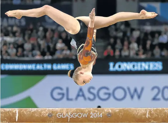  ?? Picture: REUTERS ?? TO THE T: Georgina Hockenhull of Wales performs on the beam yesterday during the women’s gymnastics apparatus final at the Commonweal­th Games in Glasgow, Scotland