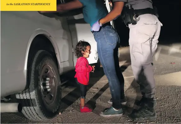  ?? JOHN MOORE / GETTY IMAGES ?? A two-year-old Honduran asylum seeker cries as her mother is searched and detained near the U.S.-Mexico border on Tuesday in McAllen, Texas.