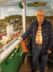 ?? BILL RETTEW JR. – DIGITAL FIRST MEDIA ?? Schuykill Valley Model Railroad Club founder Jerry Powell poses in front of just a small portion of a 1,000-squarefoot model train layout in Phoenixvil­le.