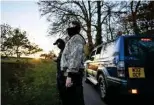  ?? ?? Members of the North London Hunt Saboteurs observe participan­ts of the Thurlow Fox Hunt.