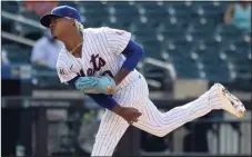  ?? Bill Kostroun / Associated Press ?? Mets pitcher Marcus Stroman delivers against the Braves during the first game of a doublehead­er on Monday in New York.