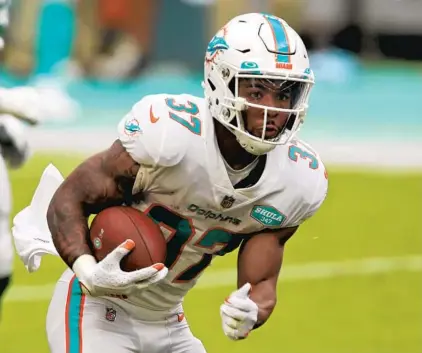  ?? JOHN MCCALL/SOUTH FLORIDA SUN SENTINEL ?? The Dolphins are heading into the 2021 season with Myles Gaskin as the team’s lead running back, and his productivi­ty hints he could do more if he can stay healthy.