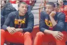  ?? ROBERTO E. ROSALES/JOURNAL ?? Lobo transfers Vance Jackson, left, and JaQuan Lyle sit at the end of the bench during a UNM game in March.