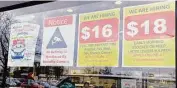  ?? Nam Y. Huh/Associated Press ?? Hiring signs fill a grocery store window recently in Arlington Heights, Ill.