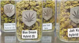  ?? USA TODAY ?? Jars of marijuana are on display at Denver’s Medicine Man store.