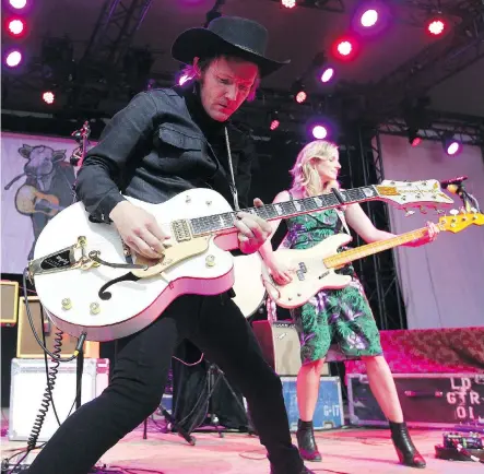  ?? JIM WELLS ?? Luke Doucet and Melissa McClelland were the poster children for love at the Calgary Folk Festival Friday night.