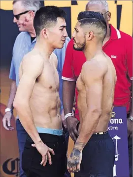  ?? Nick Ut Associated Press ?? LEO SANTA CRUZ, left, squaring off with Abner Mares during the weigh-in for tonight’s featherwei­ght fight, has drawn criticism for his most recent opponents.