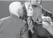  ?? John Locher / Associated Press ?? Melania Trump greets Republican vice-presidenti­al nominee Mike Pence as she arrives for the debate.
