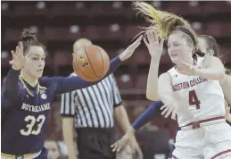  ?? AP PHOTO ?? LET IT FLY: BC’s Taylor Ortlepp passes away from Notre Dame’s Kathryn Westbeld during yesterday’s game at Conte Forum.