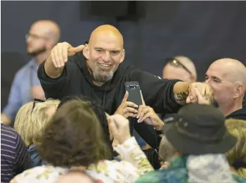  ?? PHOTOS BY JANE THERESE/SPECIAL TO THE MORNING CALL ?? Lt. Gov. and U.S. Senate candidate John Fetterman greets people during a rally with U.S. Rep. Susan Wild at the Spartan Center at Northampto­n Community College in Bethlehem on Saturday.