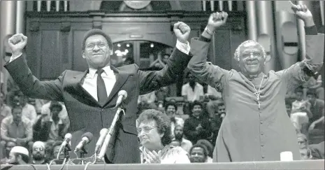  ?? PICTURE: LEON MULLER ?? TRIUMPH: Allan Boesak and Archbishop Desmond Tutu acknowledg­e the cheers of the crowd after the triumphant 1989 peace march.