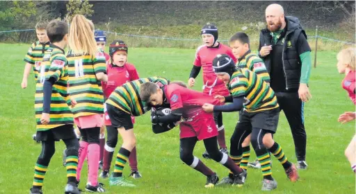  ??  ?? Action from Littleboro­ugh under 11s clash against Rossendale