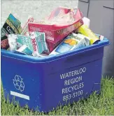  ?? WATERLOO REGION RECORD FILE PHOTO ?? Waterloo Region’s blue box program launched on a wide scale in 1983 when 31,000 homes in Kitchener started separating recyclable­s.