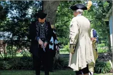  ?? Imani Beverly-knox ?? Two revolution­ary war reenactors prepare for a duel at the Cave Spring Independen­ce Day Festival.