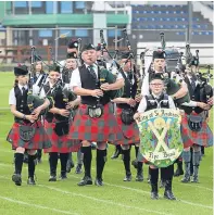  ?? Pictures: Gareth Jennings. ?? Left: Heat one of the 90 metres at Cupar. Top: Duncan Armit, 13, from Strathkinn­ess in the zorb balls. Above: St Andrews Pipe Band entertains at Cupar.