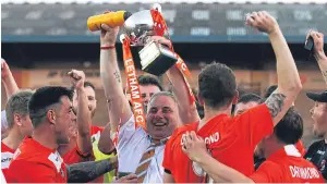  ?? Picture: Mhairi Edwards. ?? Letham AFC celebrate after a 3-1 victory over Douglas Amateurs clinched the North of Tay Cup last night.