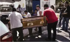  ??  ?? Family members carry the coffin of Jorge Ruiz Vazquez, who was killed in Actopan late on Friday. Photograph: Felix Marquez/AP