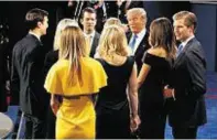  ??  ?? Donald Trump talks with his family after the debate