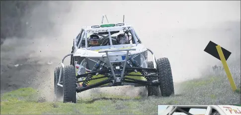  ?? Pictures: PAUL CARRACHER ?? ALL-TERRAIN: Driver Peter Stevenson puts the Rainbow track to the test in an example of the type of vehicle that will roar into action this weekend. Below, Eliza Clarke, 7, tries an enduro car for size at Rainbow.