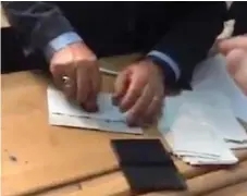  ??  ?? Video: Footage allegedly shows official stamping ballot