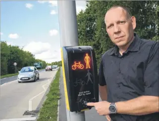  ?? Picture: Gary Browne FM4922622 / FM4922626 ?? Councillor Jim Wedgbury, who is angry about motorists jumping the red lights at the pedestrian crossing on the A2070