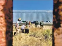  ?? ALEXANDRA MENDOZA U-T ?? Activists are questioned by Border Patrol officers July 6 after they entered what’s known as an enforcemen­t zone.