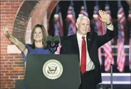  ?? Saul Loeb AFP/Getty Images ?? MIKE PENCE with wife Karen Pence at Ft. McHenry National Monument in Baltimore, where he accepted his party’s nomination as vice president.