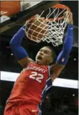  ?? JOHN AMIS — THE ASSOCIATED PRESS ?? Philadelph­ia 76ers forward Richaun Holmes dunks against the Atlanta Hawks during the second half of an NBA basketball game Friday in Atlanta.