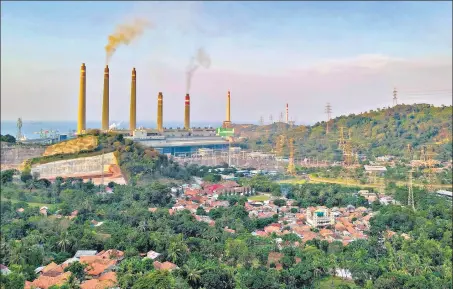  ?? AFP/FILE ?? Smoke rises from the chimneys at the Suralaya coal power plant in Cilegon, Indonesia.