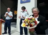  ?? MARTIN DE RUYTER/STUFF ?? Appleby fire chief Paul Eggers, left, and firefighte­r Bella Clark-Melchers congratula­te Clare Ford.